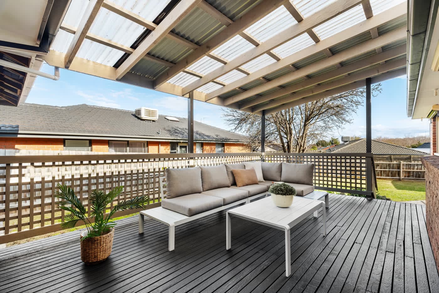 Covered alfresco deck with outdoor lounge seating