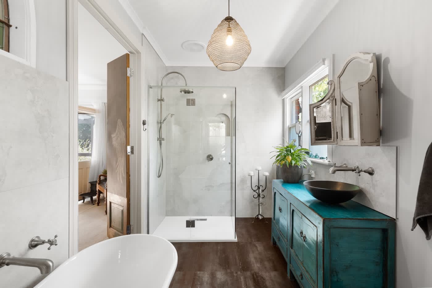 Bathroom with a freestanding bath and vintage vanity