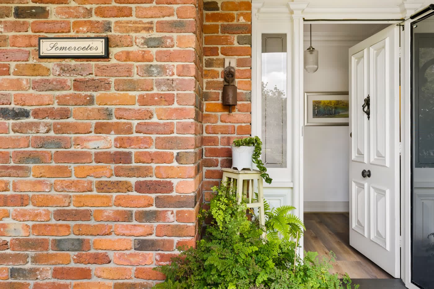 Brick corner and panelled front door of a period home