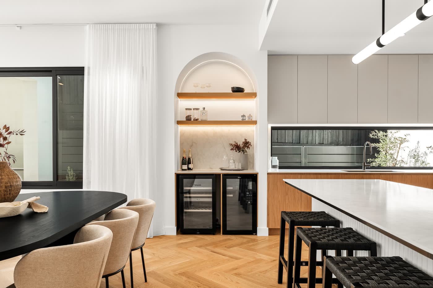 Arched bar nook with timber shelving and wine storage