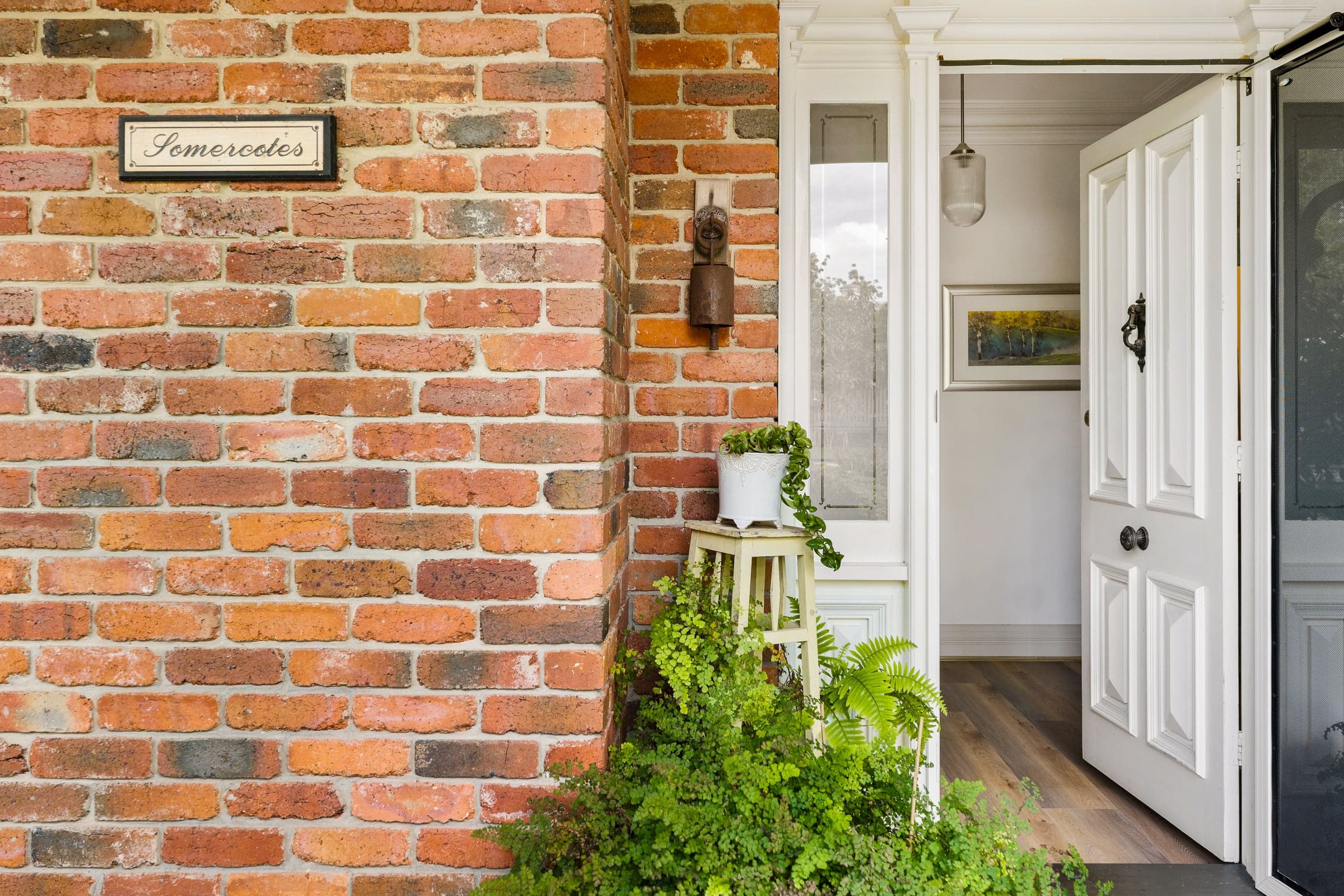 Brick corner and panelled front door of a period home