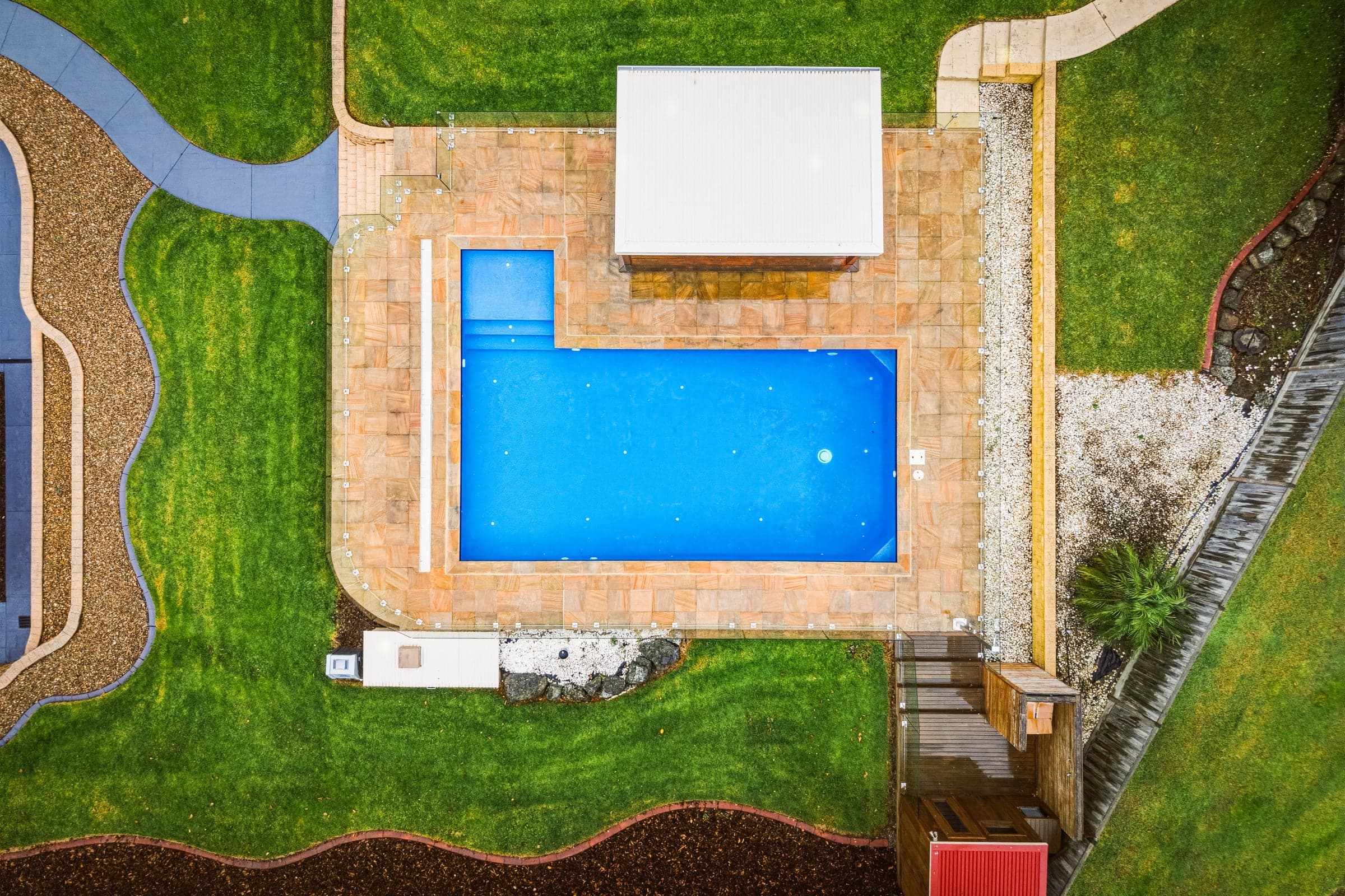 Aerial looking straight down onto the pool and its sandstone surround