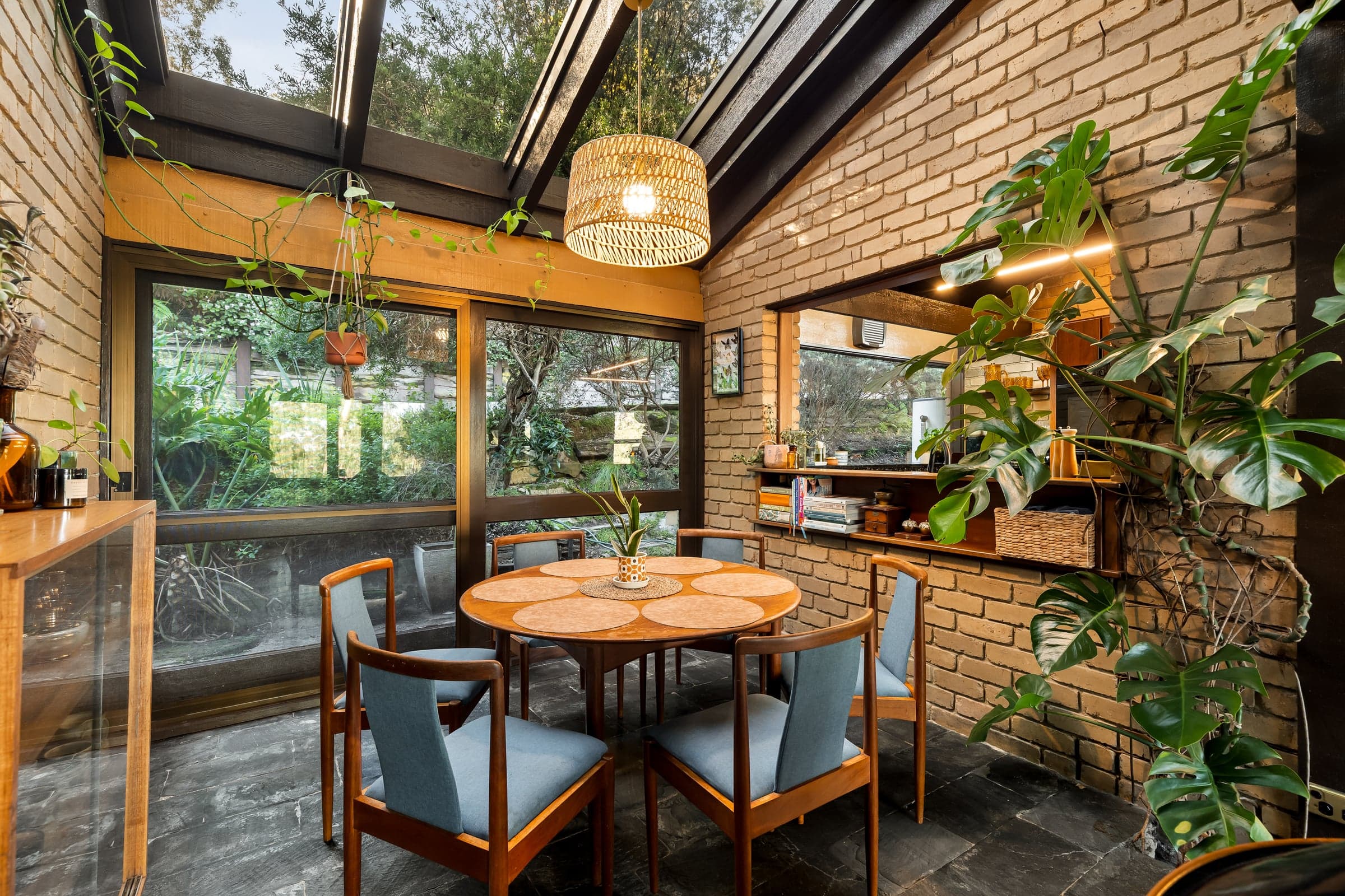 Dining area beneath angled clerestory glazing