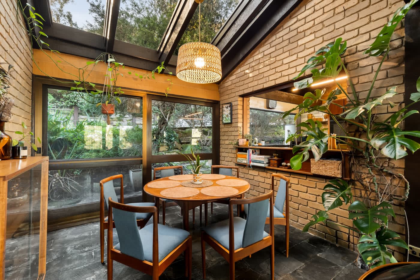 Dining area beneath angled clerestory glazing