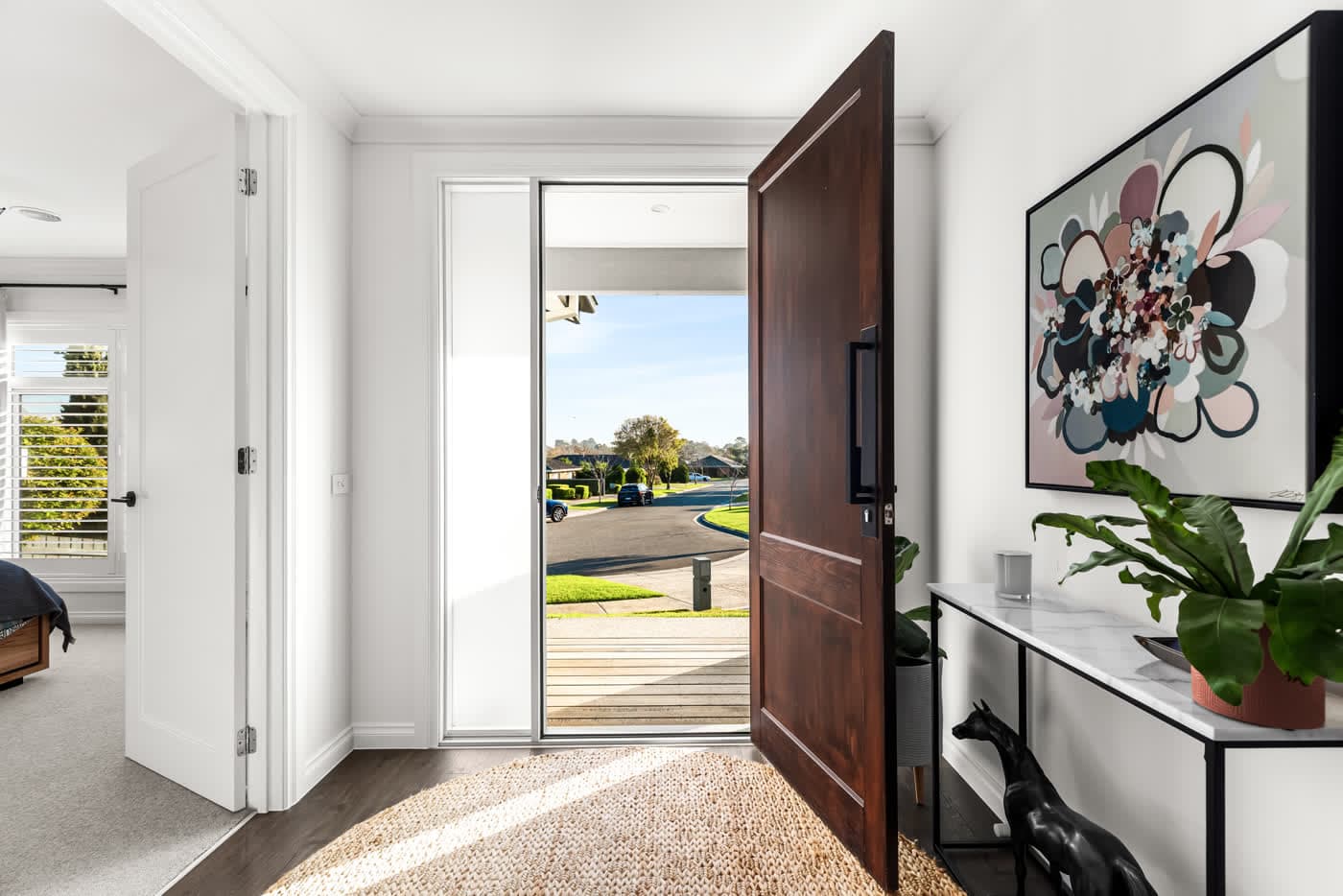 Entry hall with the front door open to the street